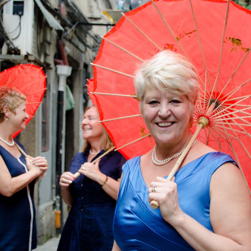 Woman holding orange umbrella